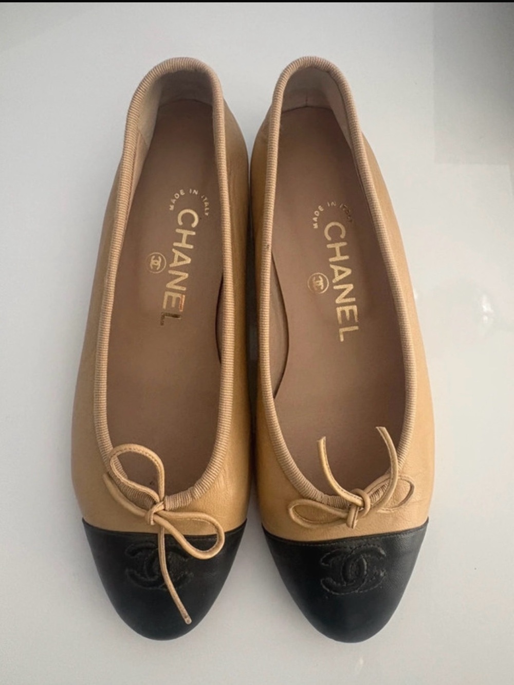 CHANEL Beige and Black Leather Cap-Toe Ballet Flats